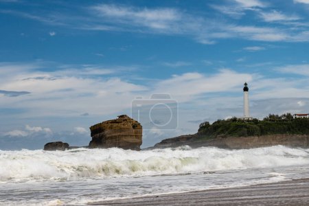 Panoramic view from Grand Plage on cliffs, lighthouse, sandy beaches of touristic Biarritz city, Basque Country, Bay of Biscay of Atlantic ocean, France in storm
