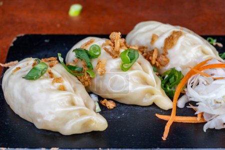 Asian food, steamed cooked filled gyoza dumplings ready to eat
