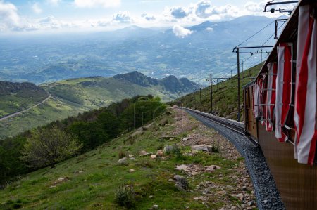 Travelling by old wooden train up to Larrun or La Rhune, Larhune mountain at the western end of the Pyrenees located on border of France and Spain, in traditional Basque provinces of Labourd and Navarra.