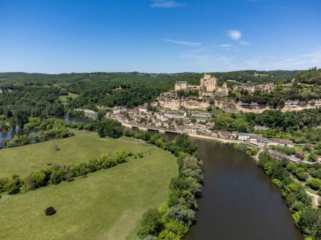 Beynac-et-Cazenac village located in Dordogne department in southwestern France with medieval Chateau de Beynac, one of most beautiful villages of France, aerial view in spring