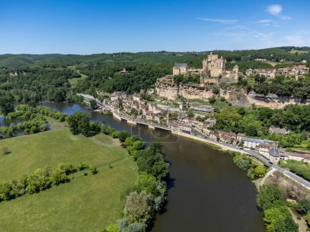 Beynac-et-Cazenac village located in Dordogne department in southwestern France with medieval Chateau de Beynac, one of most beautiful villages of France, aerial view in spring