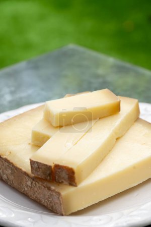 French yellow cheese Comte, varieties unpasteurised cow milk Prestige, fruity flavoured Fruite and Vieille Reserve close up
