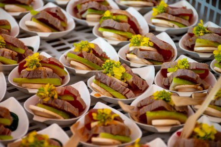 Degustation appetisers for visitors made by great chefs of haute cuisine French restaurants, summer wine festival in Tours, Loire valley, France