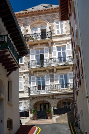 Houses and streets of touristic Biarritz city in sunny day, Basque Country, Bay of Biscay of Atlantic ocean, France