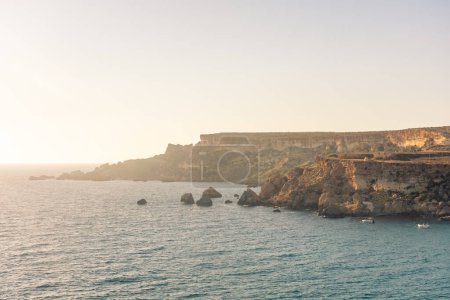 Photo for Sunset over the misty cliffs of Golden Bay, Malta - Royalty Free Image