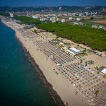 Aerial drone view of Spille beach in Albania with pine forest. High quality photo