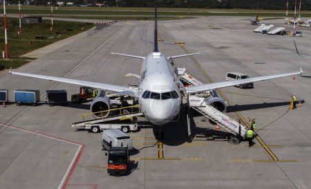 Photo for Balice, Poland - September 11, 2022: Lufthansa Airbus A319-100 ground handling at John Paul II Krakow Balice International Airport, Poland. - Royalty Free Image