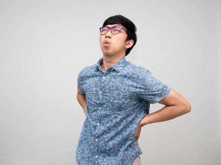 Téléchargez les photos : Asian male employee  wear glasses feels pain his back about hard working office syndrome isolated - en image libre de droit