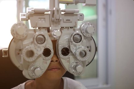 Photo for Kid eye test in hospital, child eye exam - Royalty Free Image
