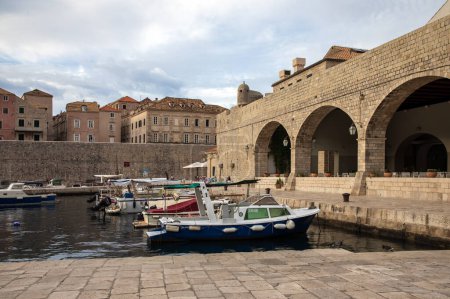 Photo for Dubrovnik, Croatia, Sepember 15th,  2023:  Boats at the harbour of the Old town of Dubrovnik, Croatia. Dubrovnik is a UNESCO World Heritage site - Royalty Free Image
