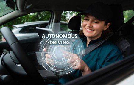 Woman driver controls an autonomous car using a smartphone