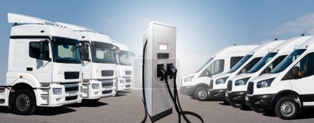 Electric vehicles charging station on a background of a trucks. Concept 