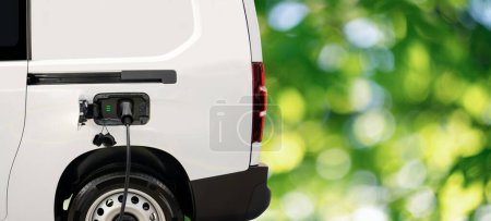 Electric delivery van on a green background. High quality photo