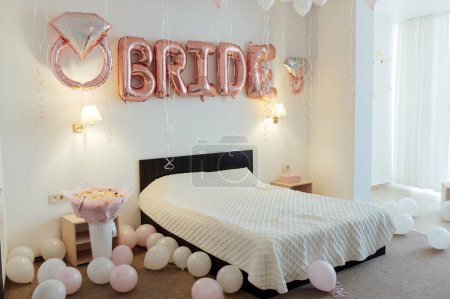 Beautiful room for the bride. Morning of the bride in the room with balloons and the inscription BRIDE from balloons