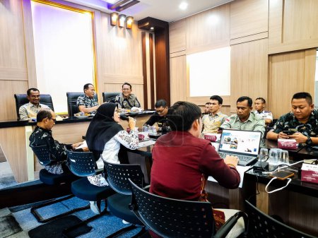 Photo for Pariaman, Indonesia - January 11 2024 : The state civil apparatus of Pariaman City is holding a meeting in the BAPPEDA room - Royalty Free Image