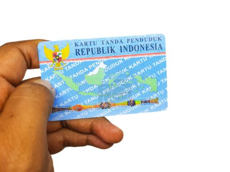 Photo for Hand holding Indonesian identity card or KTP on isolated background - Royalty Free Image