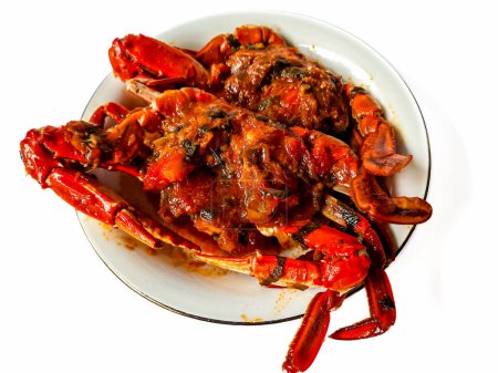 Téléchargez les photos : Crabe à la sauce ou connu sous le nom Kepiting Saus Padang est l'un des aliments traditionnels de l'Indonésie - en image libre de droit