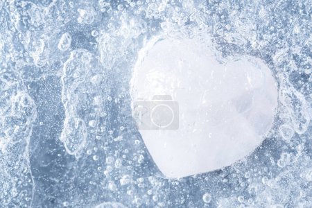 Photo for Macro shot of a stone in the shape of a heart covered in ice. Concept of being disabled to love, feel emotions, long time of being all alone - Royalty Free Image