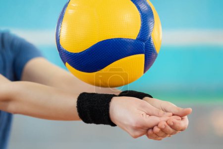 Photo for Close up of hands of a girl learning volleyball essential skills - digging. Volleyball female player practicing digging in volleyball game - Royalty Free Image