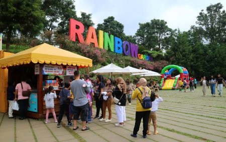 Photo for Lembang, Bandung, Indonesia - October 16th, 2022. Crowd of people in front of ticketing area of Rainbow Slide playground. Rainbow Garden is one of the tourist spots in Floating Market. - Royalty Free Image