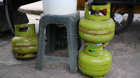 Photo for LPG gas 3 kg in Indonesia. Tabung gas or gas cylinders of liquid petroleum are produced by Pertamina, only for the poor people in Indonesia. - Royalty Free Image