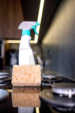 Orenge sponge and means of the cleaning gas stove on kitchen.