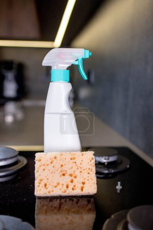 Orenge sponge and means of the cleaning gas stove on kitchen.