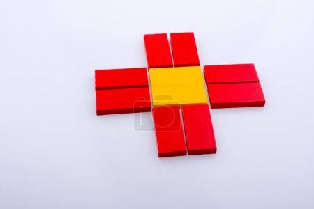 Photo for Colorful Domino Blocks forming a Sun shape on a white background - Royalty Free Image