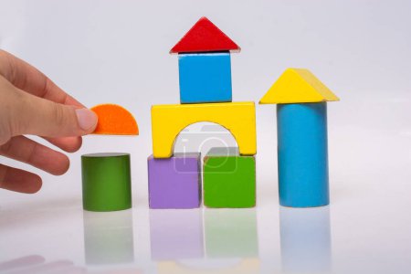 Photo for Building tower, castle  with Bright colorful wooden blocks toy - Royalty Free Image