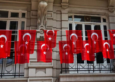Photo for Turkish national flag hang on a pole on a rope in the street in open air - Royalty Free Image