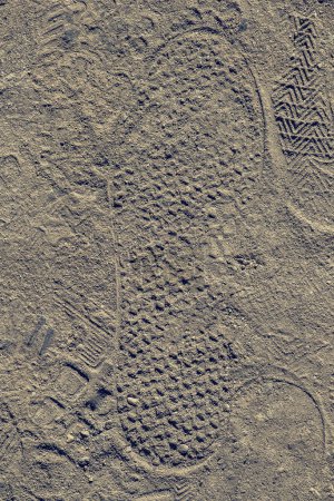 Téléchargez les photos : Footstep sur des pierres de sable texturées comme fond abstrait grunge - en image libre de droit