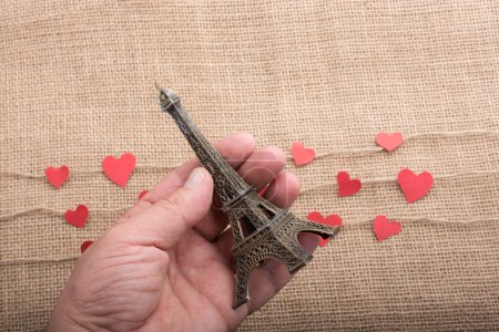 Photo for Love concept with Eiffel tower and paper heart on threads - Royalty Free Image