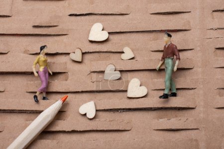Photo for Tiny figurine of man  and woman miniature model and heart as love concept - Royalty Free Image