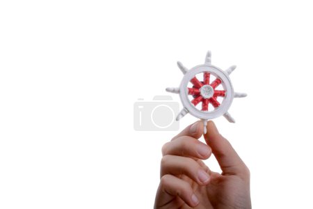 Photo for Isolated Ship steering wheel onhand - Royalty Free Image