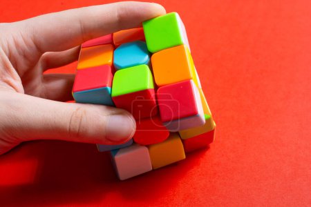 Photo for Rubik's cube in female hands. problem solving - Royalty Free Image