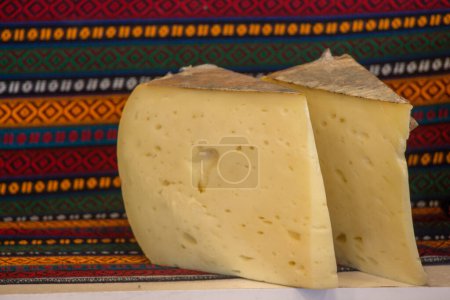 Photo for Cuts of kashkaval or kasseri  cheese for sale on the shelf - Royalty Free Image
