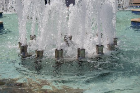 Photo for The fountains gushing sparkling water in a pool in a park - Royalty Free Image