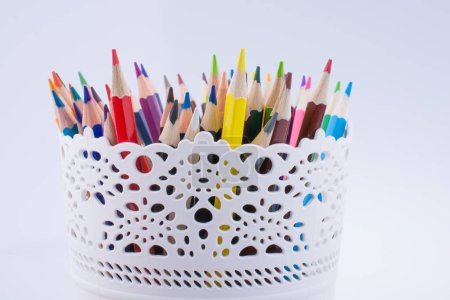 Photo for Colorful pencils in a vase on a white background - Royalty Free Image