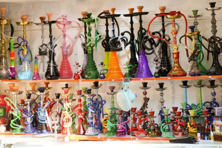 Photo for Group of eastern hookahs placed of various colors on a shelf - Royalty Free Image