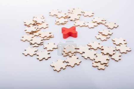 Photo for Pieces of jigsaw puzzle around x as problem solution business concept - Royalty Free Image