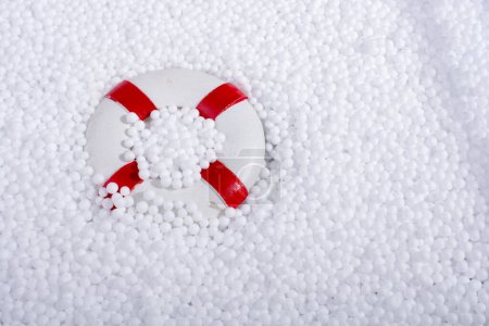 Photo for Lifesaver on little  white polystyrene foam balls - Royalty Free Image