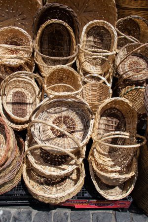 Photo for Empty wicker baskets are for sale in a market place - Royalty Free Image