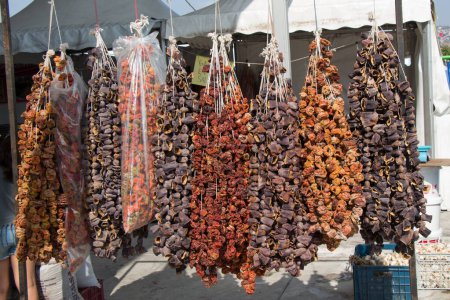 Photo for Dried eggplants  peppers and vegetables hanging up at Turkish grocery - Royalty Free Image
