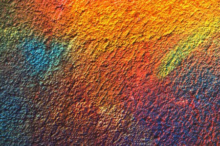 Foto de Superficie de pared pintada de varios colores como textura de fondo abstracta - Imagen libre de derechos