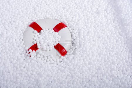 lifesaver on little  white polystyrene foam balls