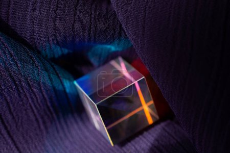 Luminous prism cubes refract light in different colors.