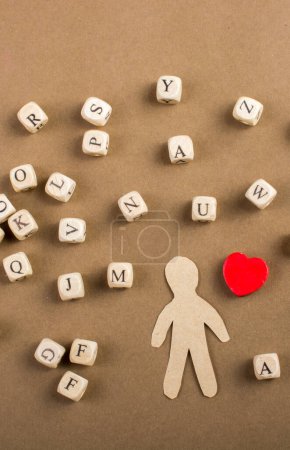 Photo for Letter cubes of made of wood  and man figurine and heart shape - Royalty Free Image