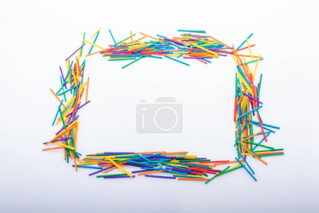 Geometric shapes made with colorful sticks as creative concept
