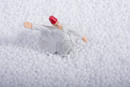 Sufi Whirling Dervish on little  white polystyrene foam balls