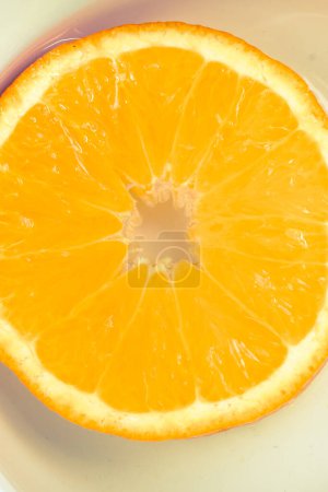 Photo for A view of a juicy, sweet and ripe cut orange fruit - Royalty Free Image